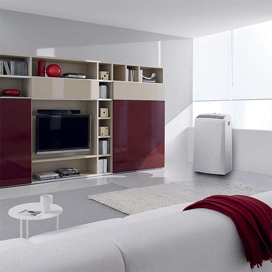 White portable air conditioner, Delonghi N82EC, 9400BTU, in modern living room.