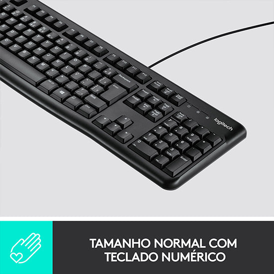 Black Logitech keyboard with cord, numeric keypad, and white lettering.