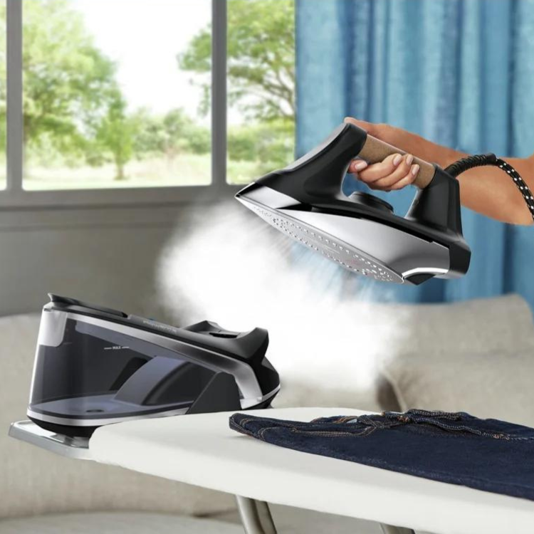 Rowenta Easy Steam iron with boiler, black, 2400W, steam coming out.