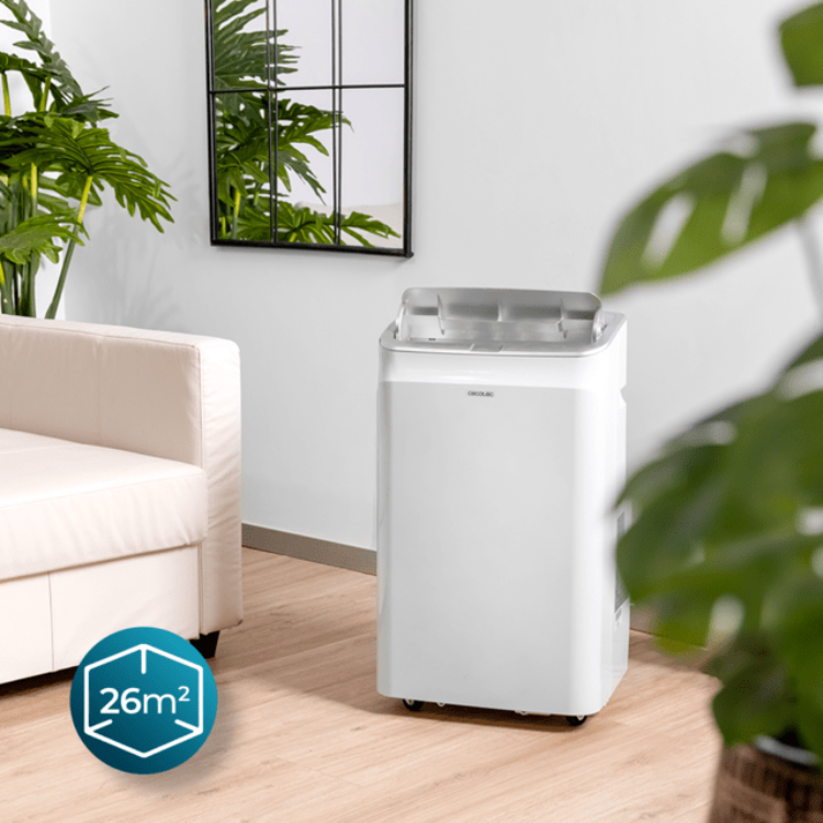Cecotec ForceClima 12600 portable air conditioner, white, 12000BTU, in a living room setting.