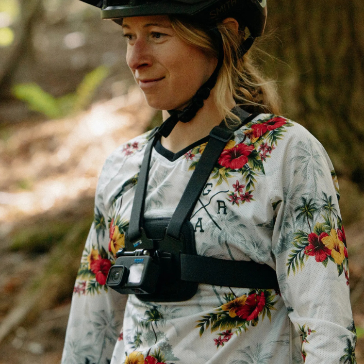 GoPro Chesty chest mount on a woman wearing a floral shirt and helmet.