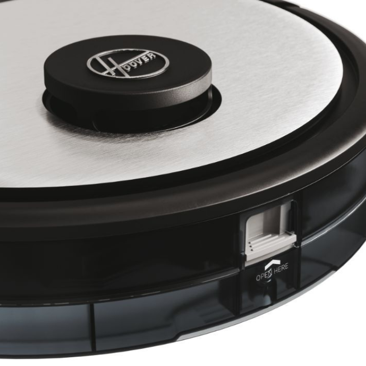 Black Hoover robot vacuum cleaner, close-up of silver and black top with logo and open button.