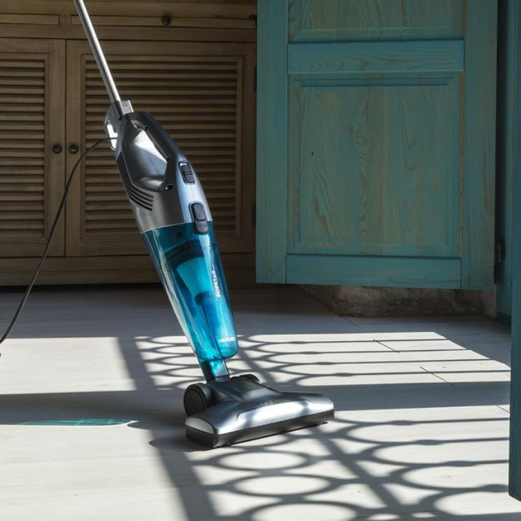 Cecotet Conga Popstar 1000 Duostick vacuum, silver and blue, on white tile floor.