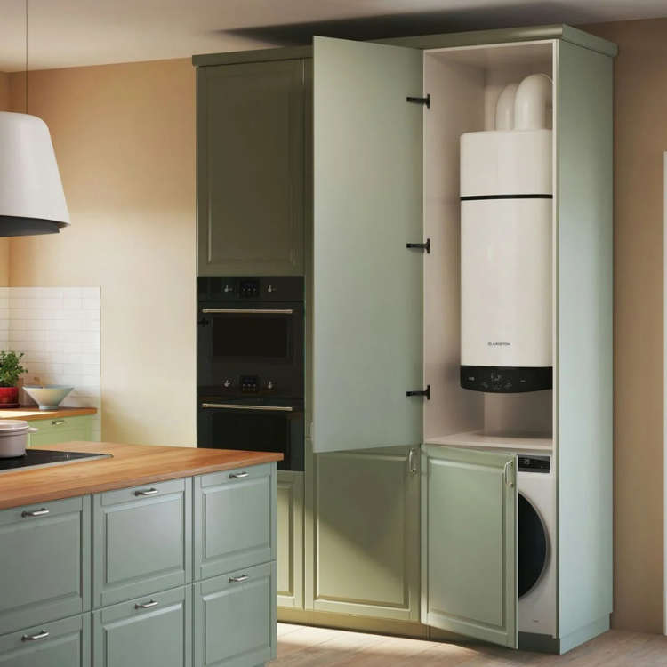 White Ariston water heater in sage green kitchen cabinet.