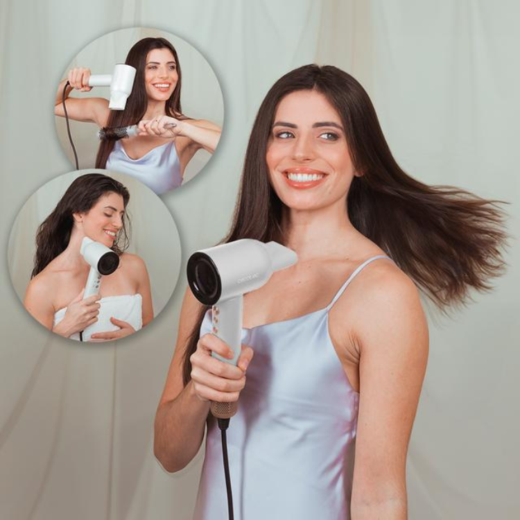 Woman with long brown hair holding white Cecotec Ioni Care Rockstar hair dryer.