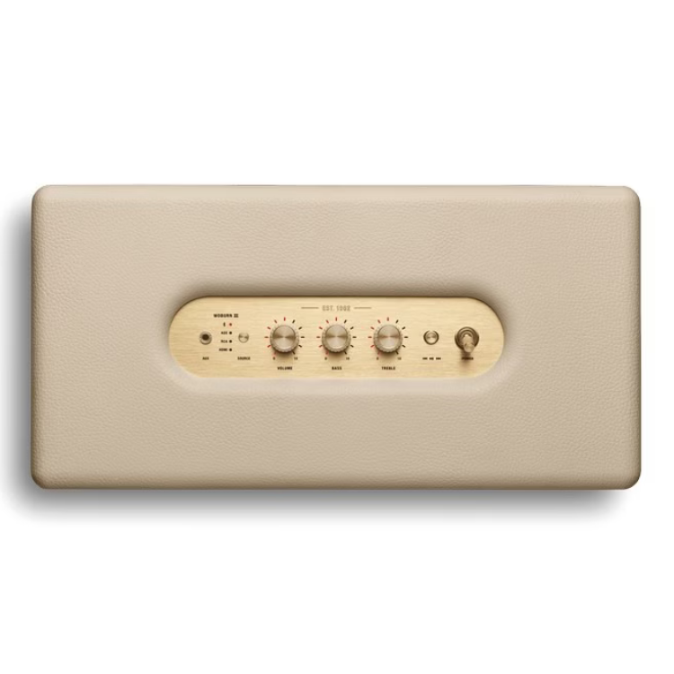 Marshall Woburn III Bluetooth speaker, cream-colored, with wooden control panel and knobs.