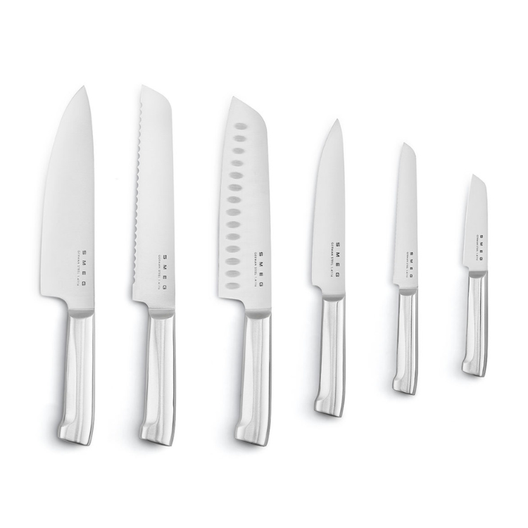 SMEG knife set, 6 pieces, silver blades, clear handles, blue accents not visible.