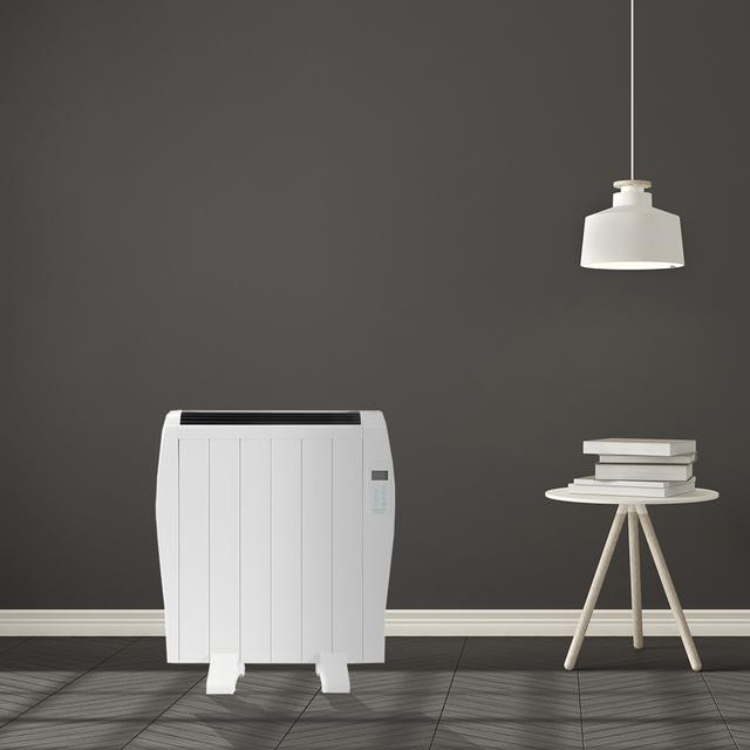 White Cecotec Ready Warm 1200 Thermal electric heater, 900W, on dark floor.