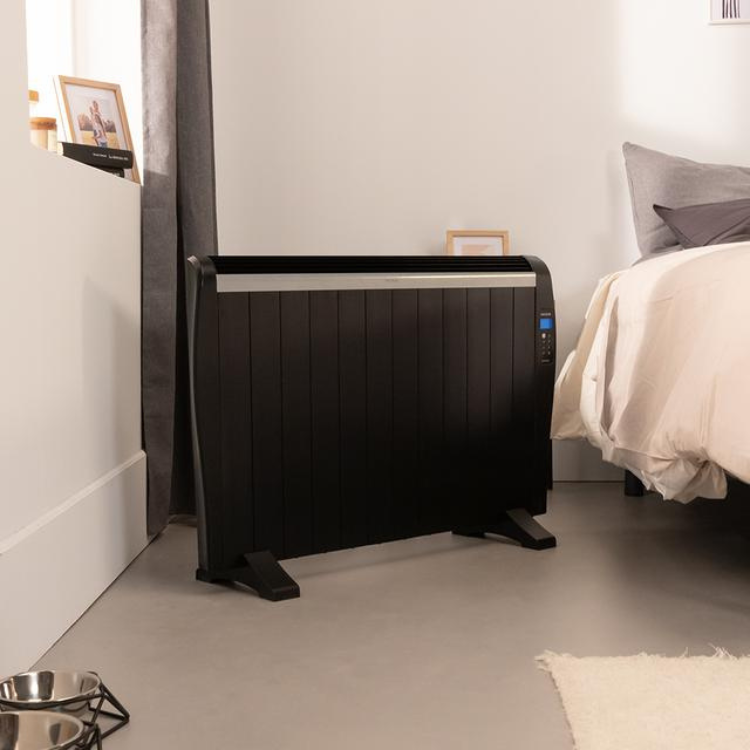 Black Cecotec Ready Warm 2500 Thermal heater, 1800W, beside bed.