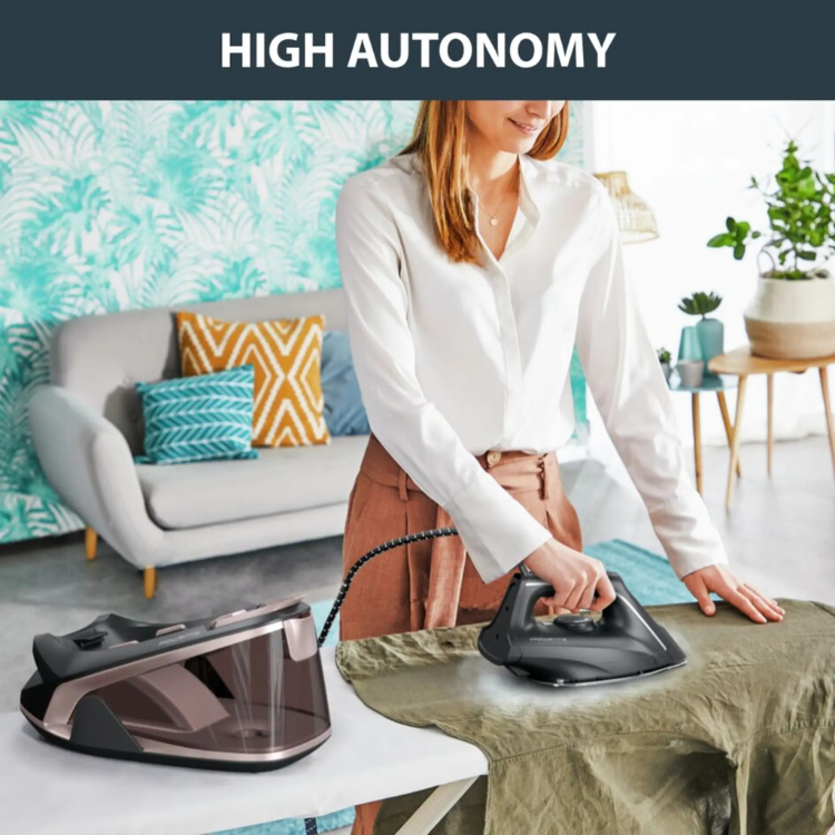 Rowenta VR7141F0 Easy Steam iron with caldera, black and rose gold, 2400W, woman ironing green fabric.