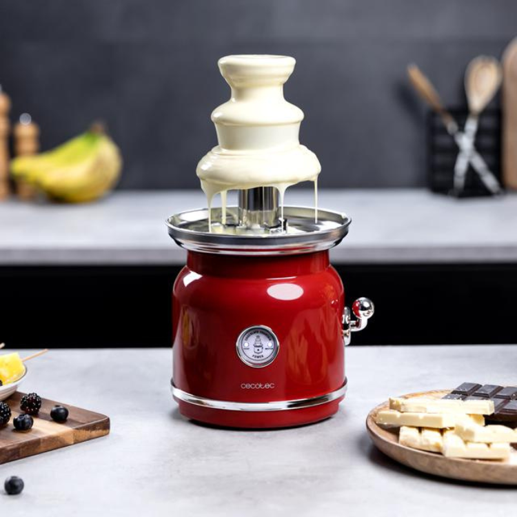 Red Cecotec chocolate fountain with white chocolate, silver accents, and temperature control dial.