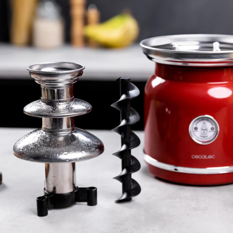 Red Cecotec chocolate fondue set with silver accents and black spiral component.