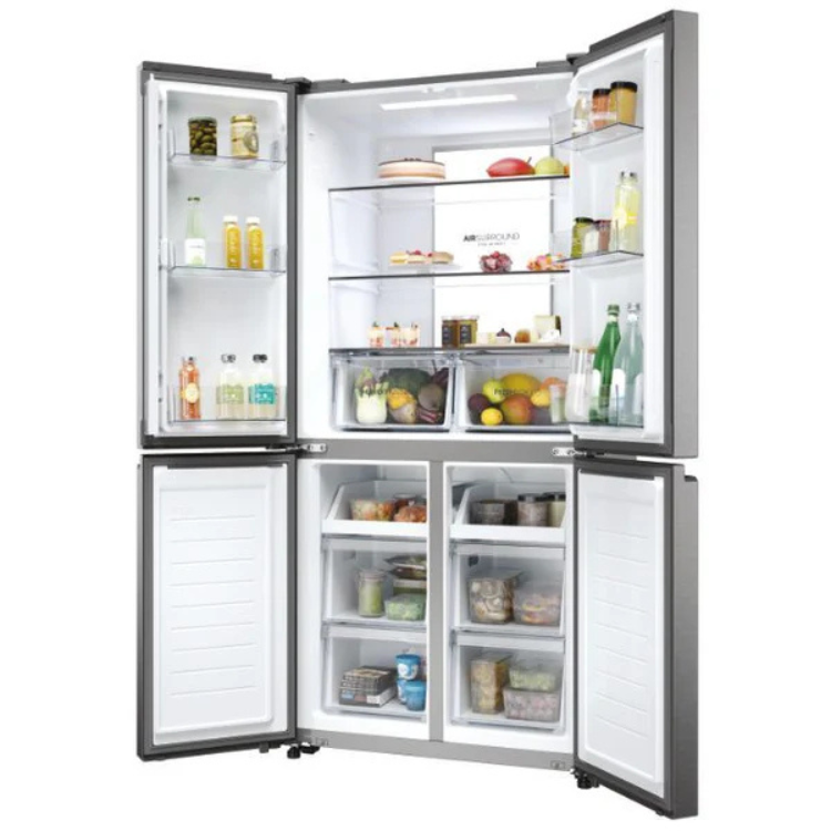 Haier HCR7818DNMM American fridge, 467L, stainless steel, open doors showing organized interior with food and drinks.