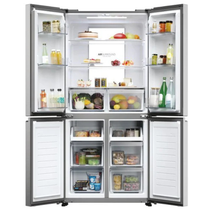 Haier HCR7818DNMM American fridge, stainless steel, 467L, open doors showing organized interior with food and drinks.