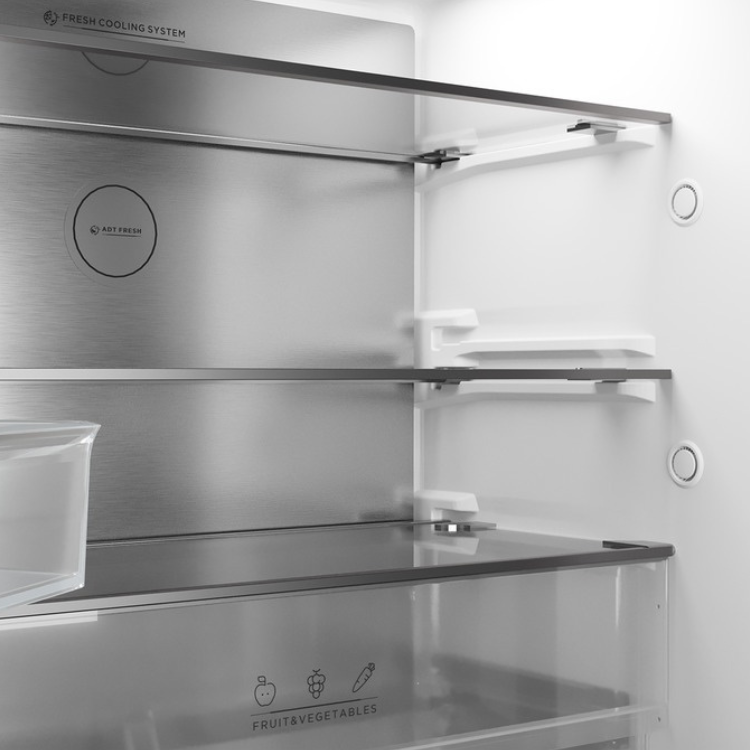 Teka RFD77825 black American fridge interior with shelves and fruit & vegetable compartment.