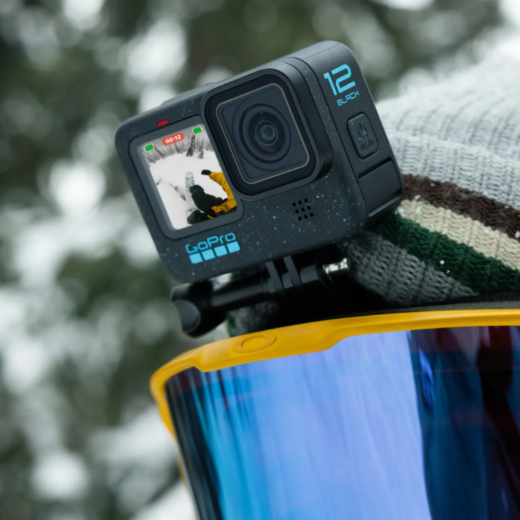 GoPro 12 Black camera on yellow ski goggles, displaying skier on screen.