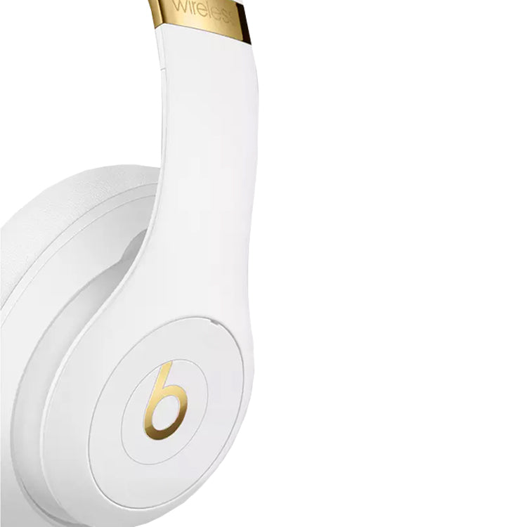 White Beats Studio 3 wireless headphones with gold accents