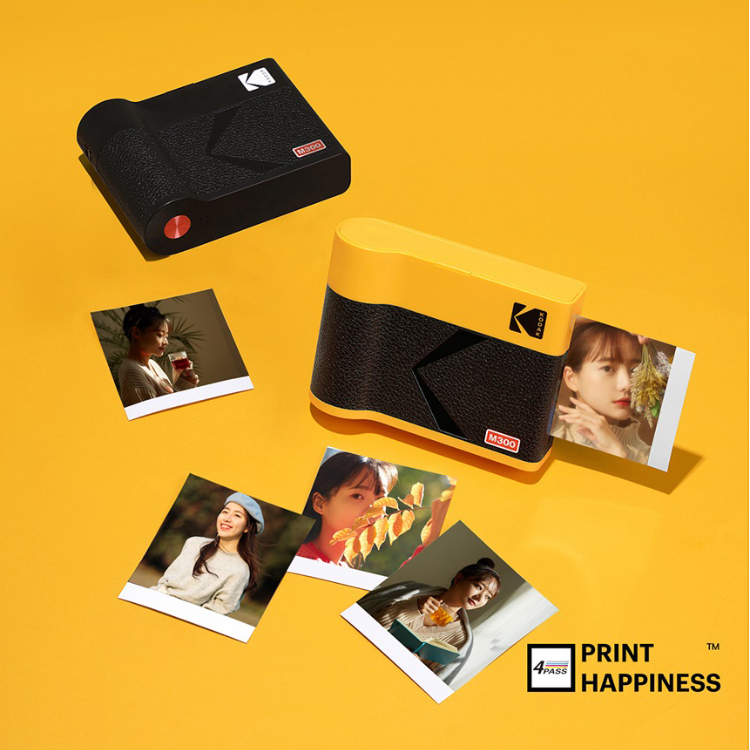 Kodak Mini 3 Era M300 yellow portable photo printer with photos.
