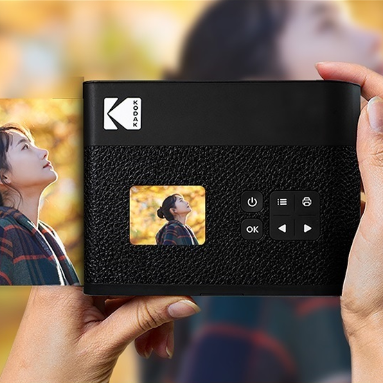 Kodak Mini Shot 3 Era MS300 instant camera, black, with white Kodak logo and control buttons.