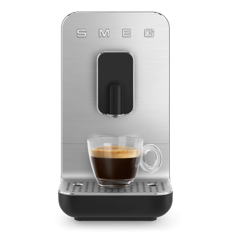 Smeg automatic coffee machine, silver and black, with a cup of espresso.
