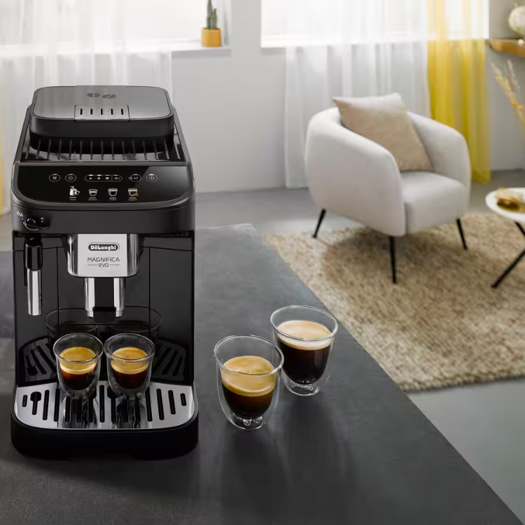 Black De'Longhi Magnifica Evo automatic coffee machine with four cups of espresso.