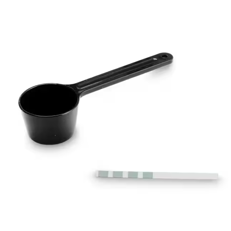 Black plastic measuring scoop and white plastic measuring spoon with green markings.