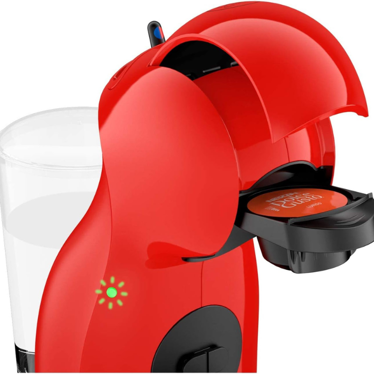 Red Delonghi Dolce Gusto Piccolo XS coffee machine with open capsule holder and green power light.