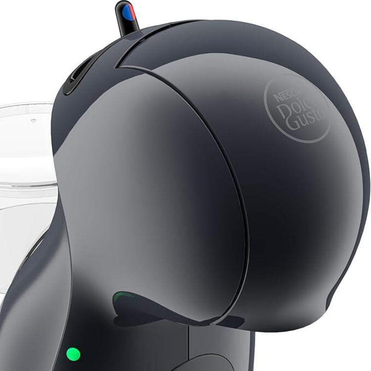 Black Delonghi Dolce Gusto Piccolo XS coffee machine with green light and clear water tank.
