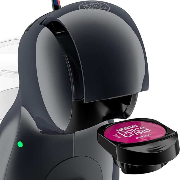 Black Delonghi Dolce Gusto Piccolo XS coffee machine with pink capsule.