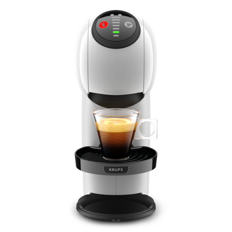 White Krups Dolce Gusto Genio S coffee machine with black accents and a cup of coffee.
