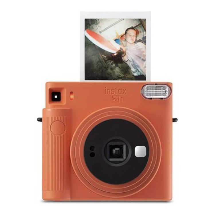 Fujifilm Instax SQ1 orange instant camera with photo ejecting.