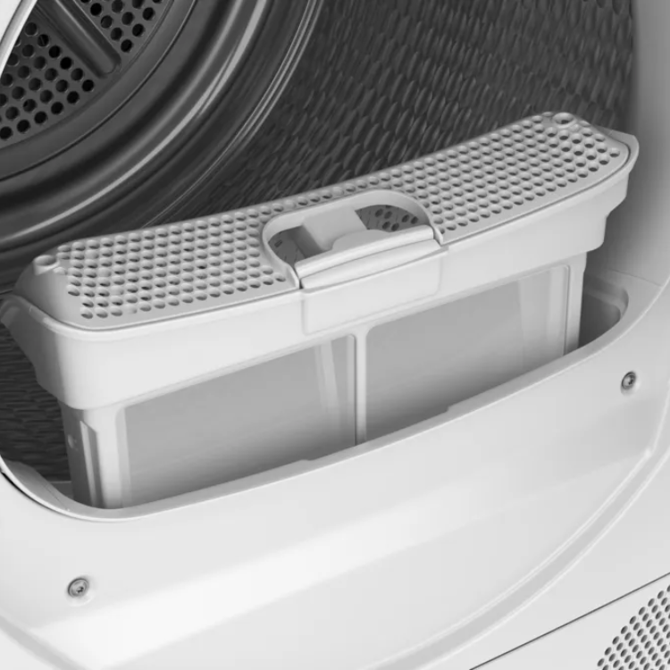 Bosch Serie 4 heat pump dryer interior with open door and white filter tray.