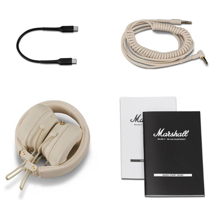 Marshall Major V cream headphones, on-ear design, with coiled audio cable and USB charging cable, and product manuals.