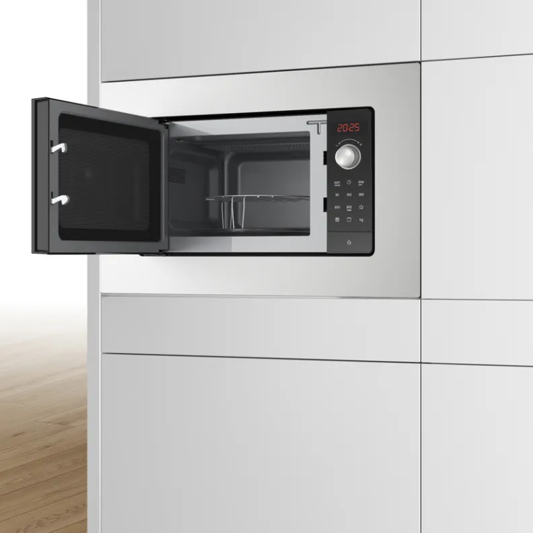 Bosch Serie 2 BEL623MS3 stainless steel built-in microwave with digital display and open door.