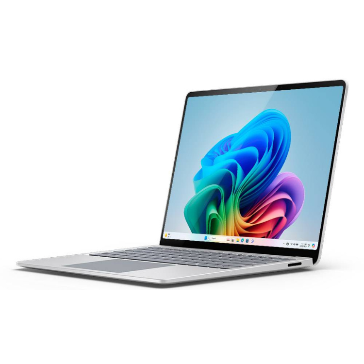 Microsoft Surface Laptop, silver, 13.8" screen, colorful wallpaper on display.