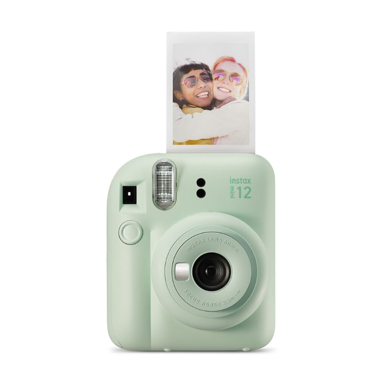 Fujifilm Instax Mini 12 green instant camera with photo ejecting.