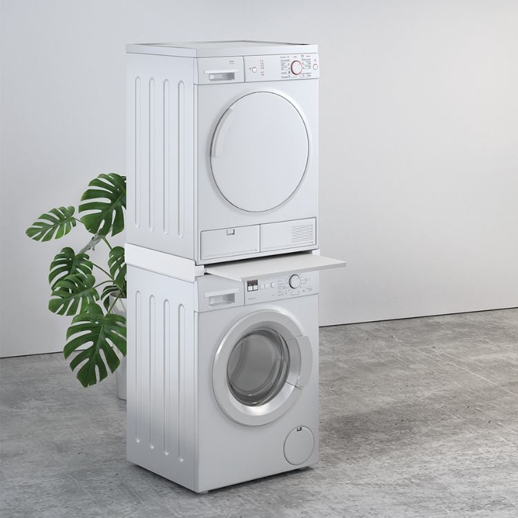 White stacked washer and dryer with vertical mounting bracket, green plant beside.