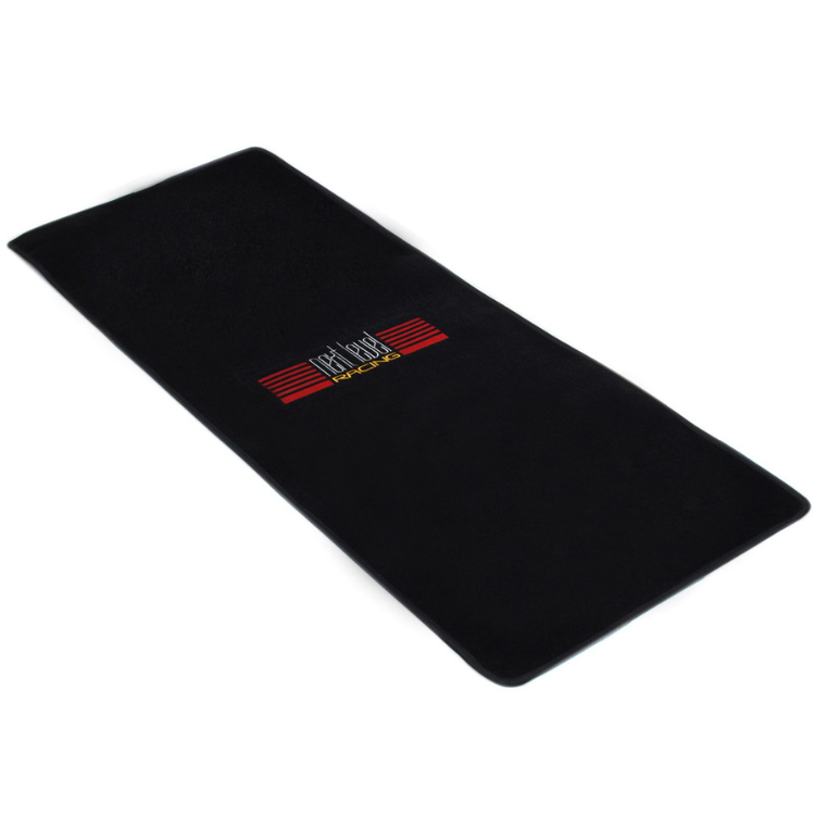 Black Next Level Racing floor mat with red and yellow logo