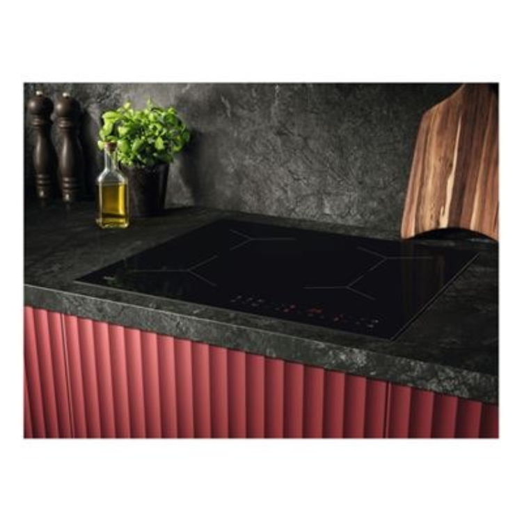 Black induction hob AEG on red kitchen unit with grey marble countertop.