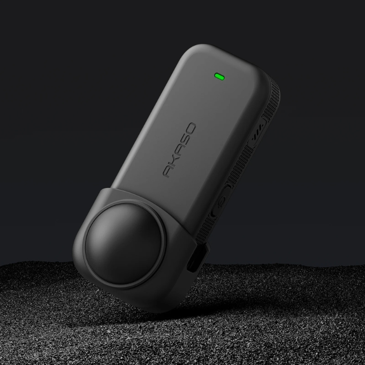 Black Akaso lens protector with green light, rectangular with rounded edges and circular lens cover.
