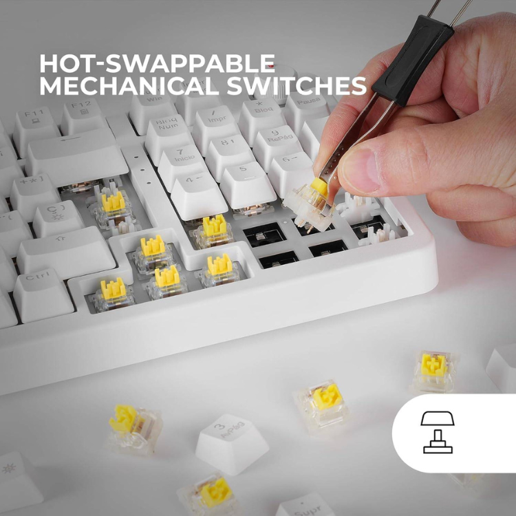 Mars Gaming white mechanical keyboard with yellow switches and hand replacing switch.