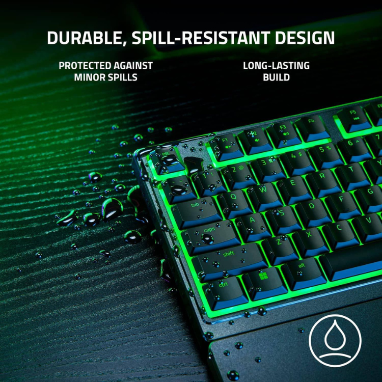 Black Razer gaming keyboard with green RGB lighting and spill-resistant design.