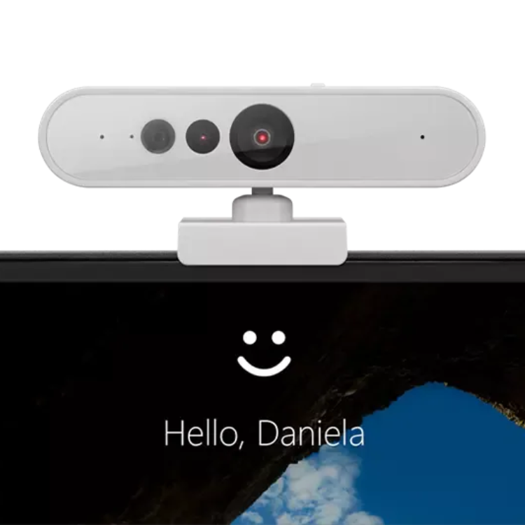 Lenovo webcam, gray, 3 camera lenses, on monitor.