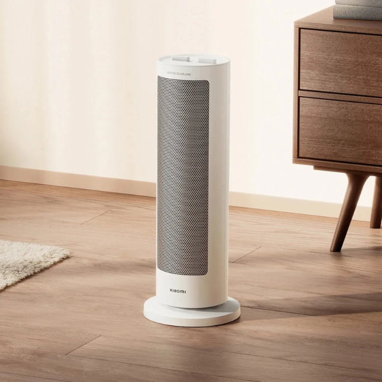 Xiaomi white electric fan heater, 2000W, standing on wooden floor.