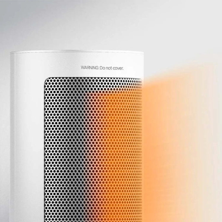 Xiaomi 2000W white electric fan heater with warning label and orange heat emission.
