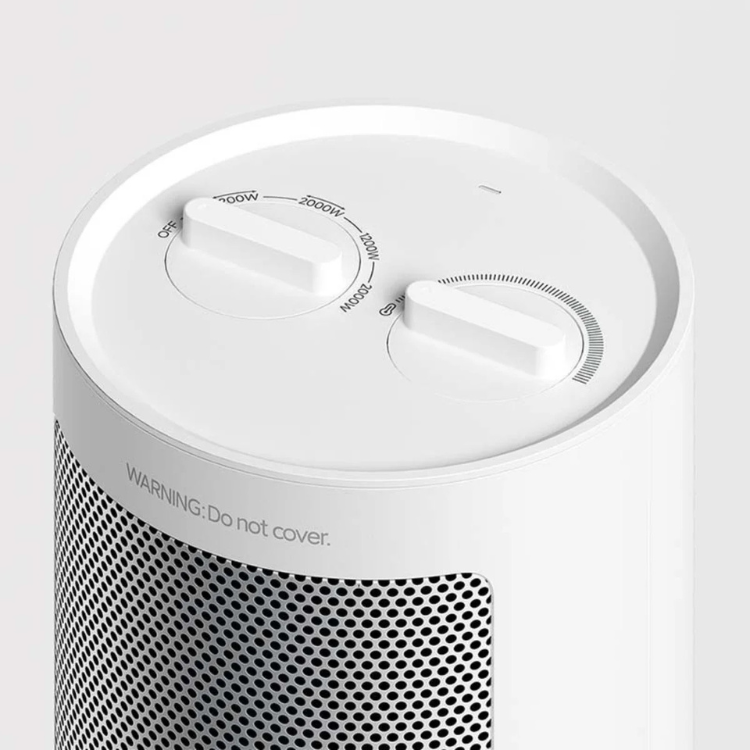 White Xiaomi electric fan heater, 2000W, close-up of control dials and mesh grille.